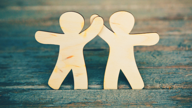 Stick Figure Cutouts high-fiving each other