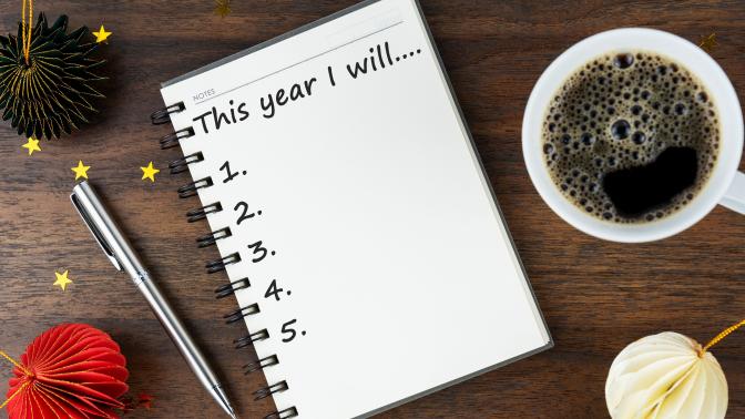 A notebook with an unfinished list of New Year's Resolutions