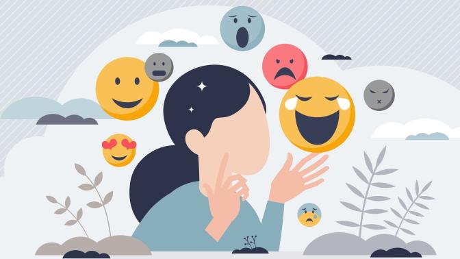 A woman is surrounded by emoji, representing the emotional spectrum