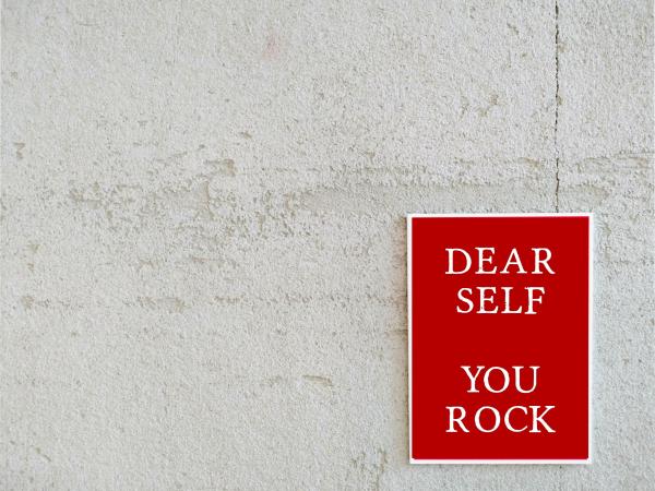 Wall with a sing that reads: 'Dear self: you rock'