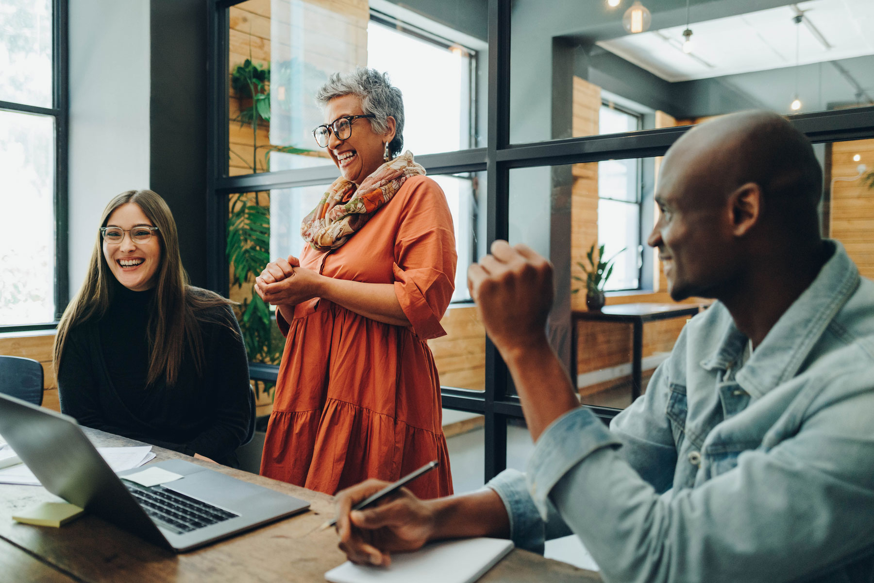 A group of employees laughing